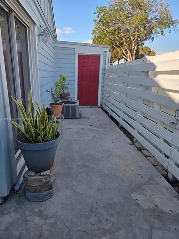 a living room with furniture and a lamp