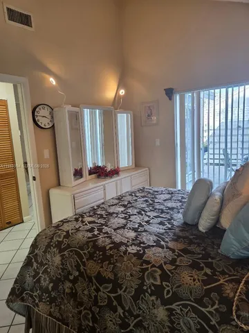 a view of a two chairs in the patio