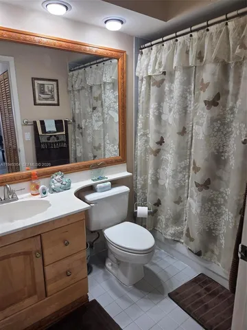 a kitchen with stainless steel appliances a refrigerator sink and cabinets