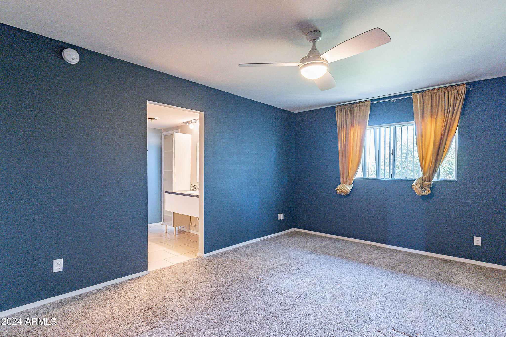 1630 East Georgia Avenue, Unit 204 Phoenix, AZ 85016 - Photo 13 of 23 a view of empty room with window and ceiling fan