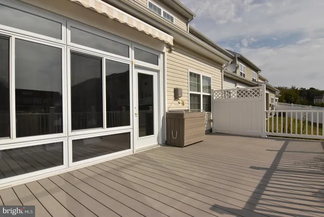 a view of a balcony with wooden floor