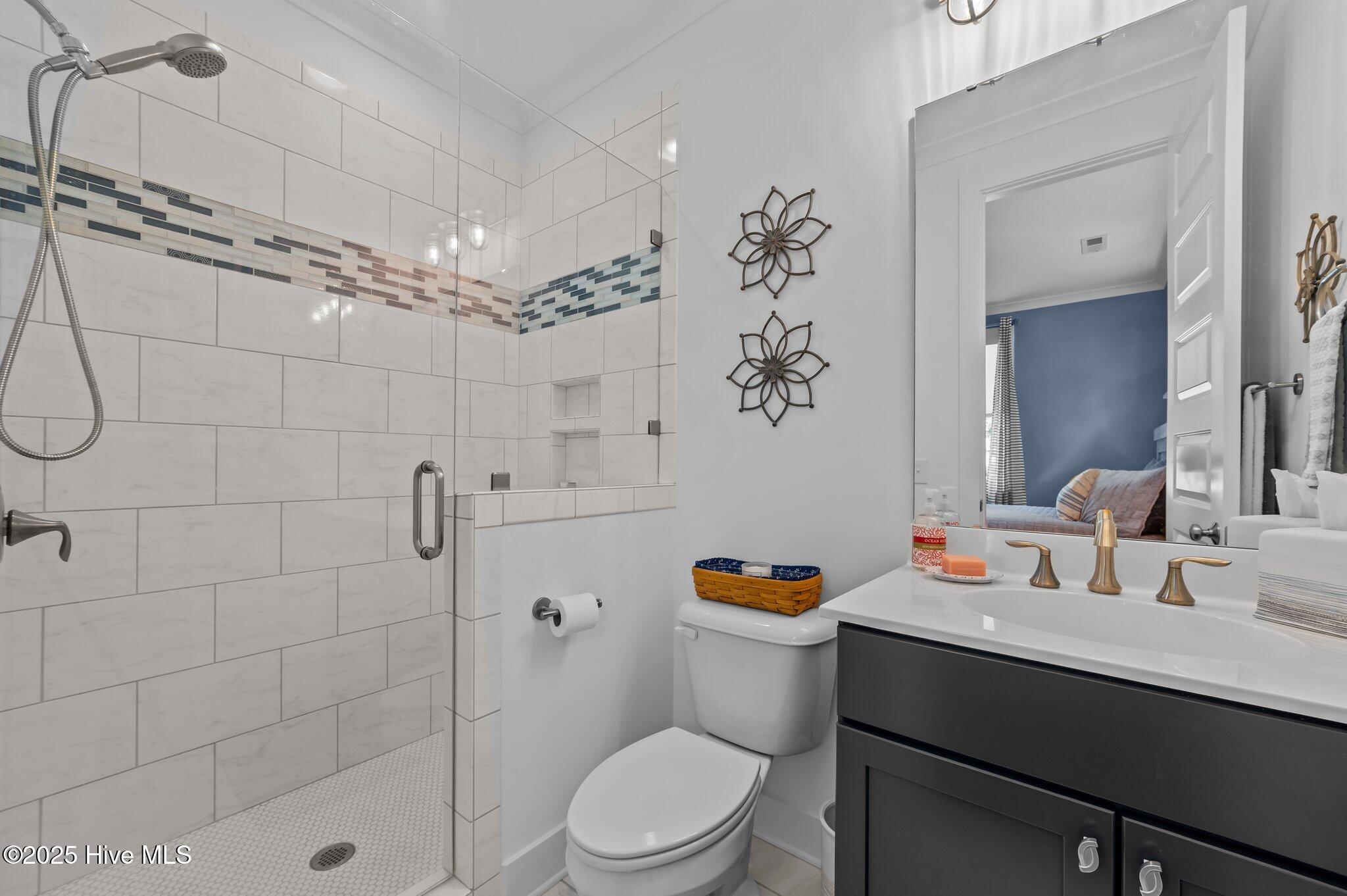 233 East Water Street Washington, NC 27889 - Photo 35 of 47 en-suite guest bathroom with tiled shower