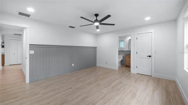 a view of a park with large trees