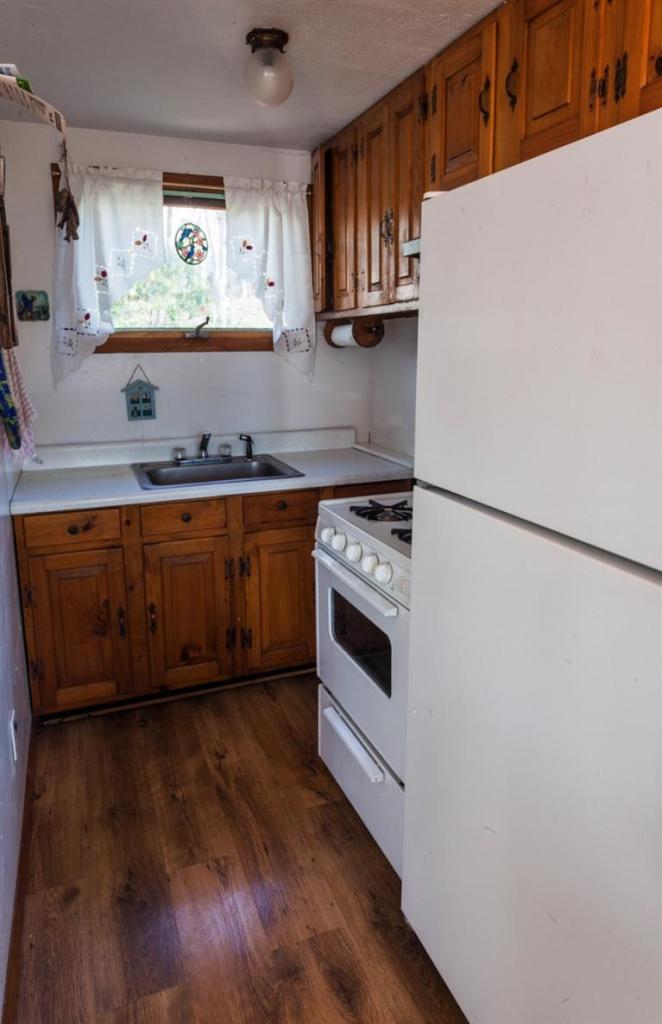 11 Josephs Road Truro, MA 02666 - Photo 9 of 19 a kitchen with stainless steel appliances a stove a sink and a refrigerator
