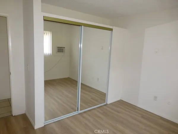 wooden floor and closet in a room