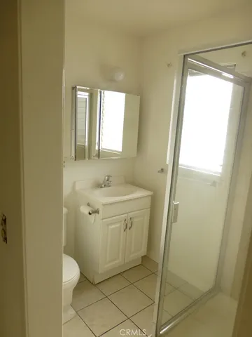 a bathroom with a sink a mirror and a shower