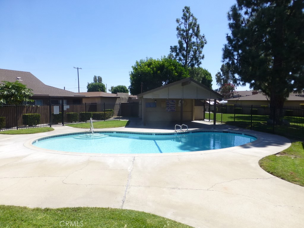 2115 Broden Street Anaheim, CA 92802 - Photo 4 of 23 a view of a house with swimming pool