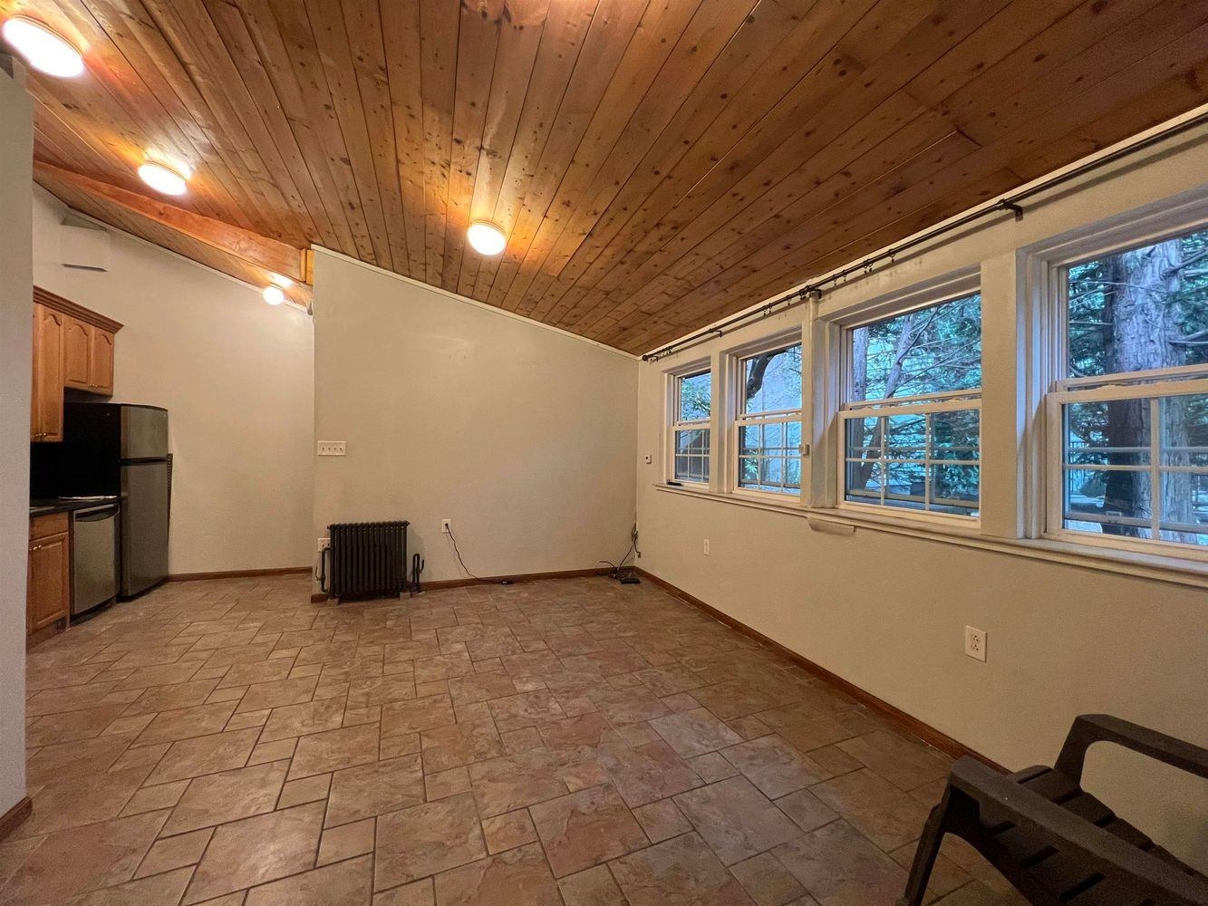 334 Paterson Plank Road, Unit 1 Jersey City, NJ 07307 - Photo 1 of 20 a view of an empty room with a window