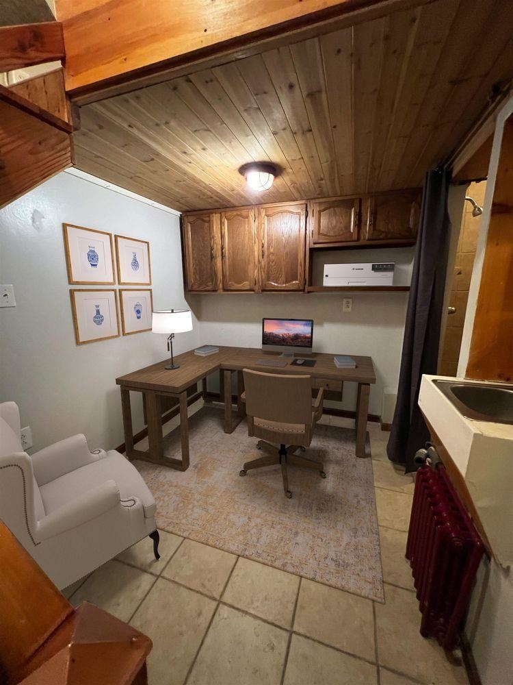 334 Paterson Plank Road, Unit 1 Jersey City, NJ 07307 - Photo 11 of 20 a room with furniture and a projector screen