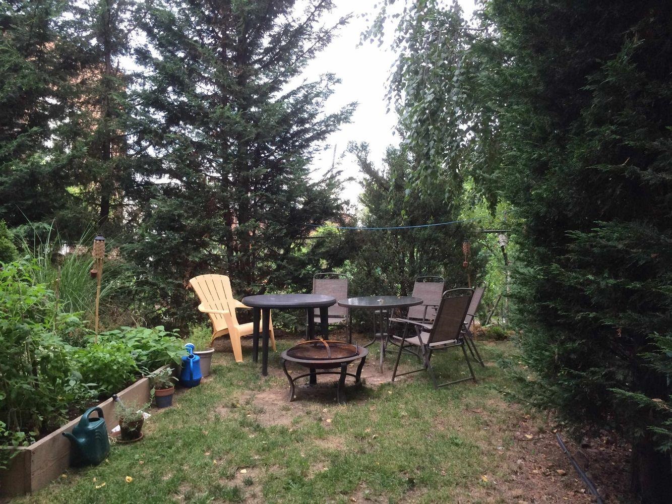 334 Paterson Plank Road, Unit 1 Jersey City, NJ 07307 - Photo 20 of 20 a backyard of a house with table and chairs