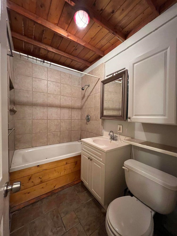 334 Paterson Plank Road, Unit 1 Jersey City, NJ 07307 - Photo 8 of 20 a bathroom with a sink mirror toilet and bathtub