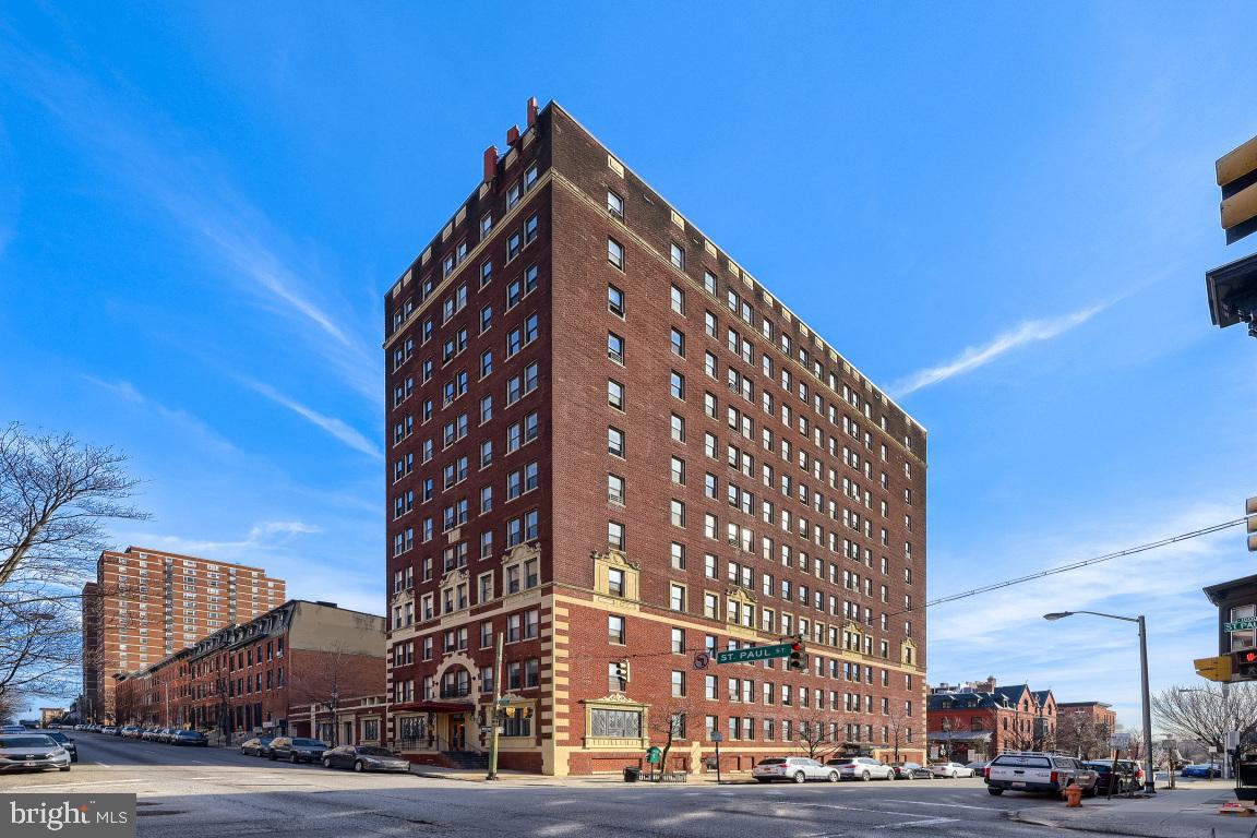 1001 St Paul Street, Unit 12D Baltimore, MD 21202 - Photo 1 of 17 Historic brick building against a clear sky.