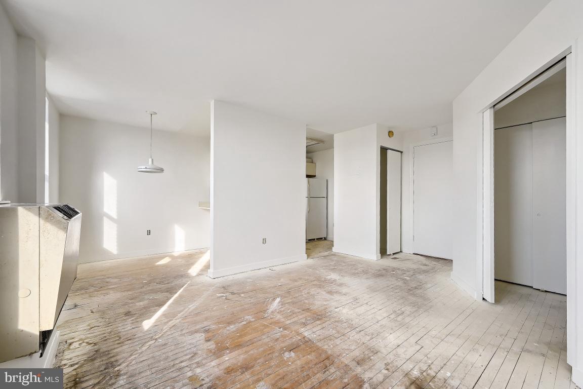 1001 St Paul Street, Unit 12D Baltimore, MD 21202 - Photo 3 of 17 Spacious, sunlit room ready for transformation.