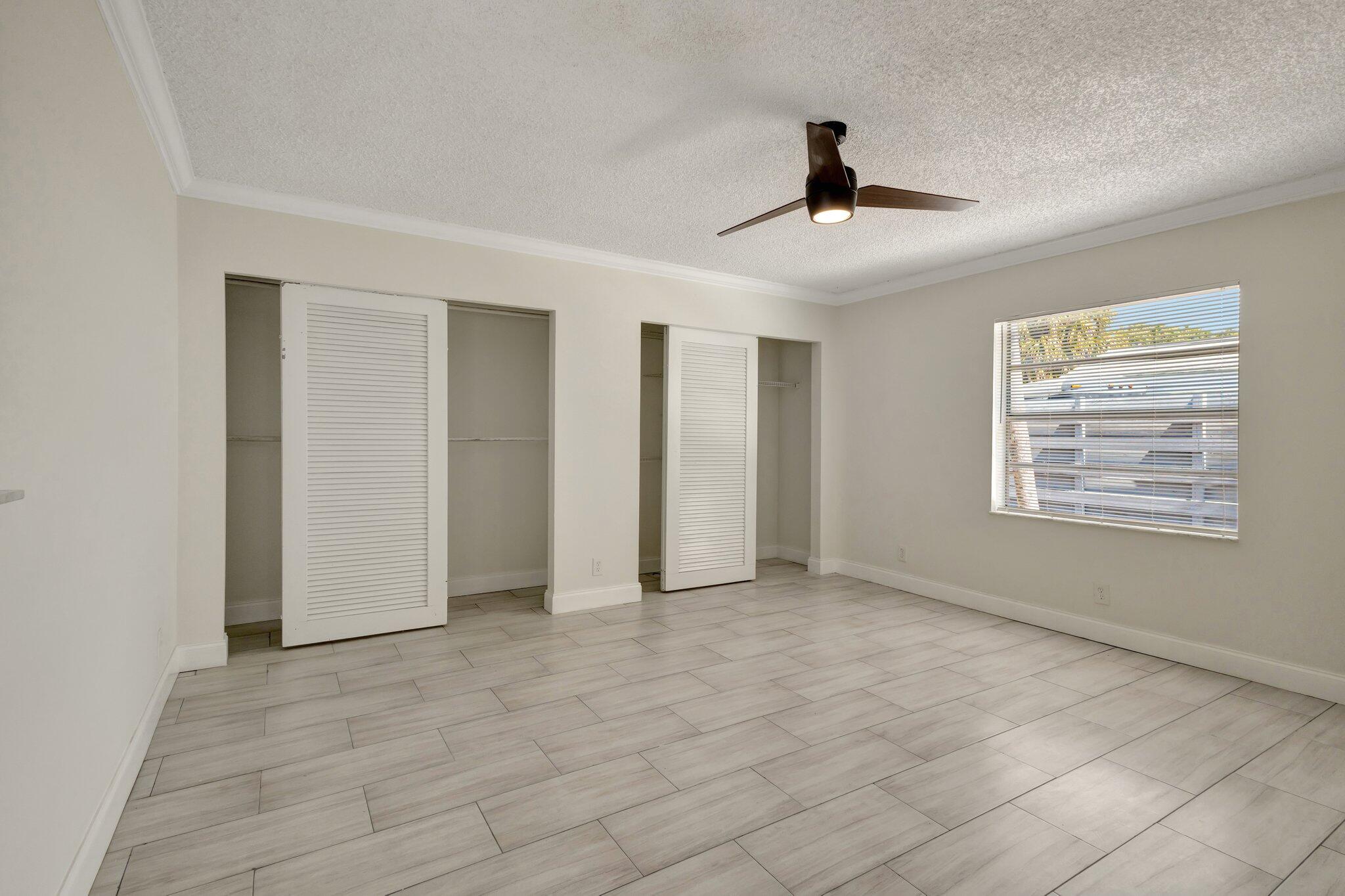 1225 16th Avenue North Lake Worth Beach, FL 33460 - Photo 5 of 18 a view of an empty room with a window
