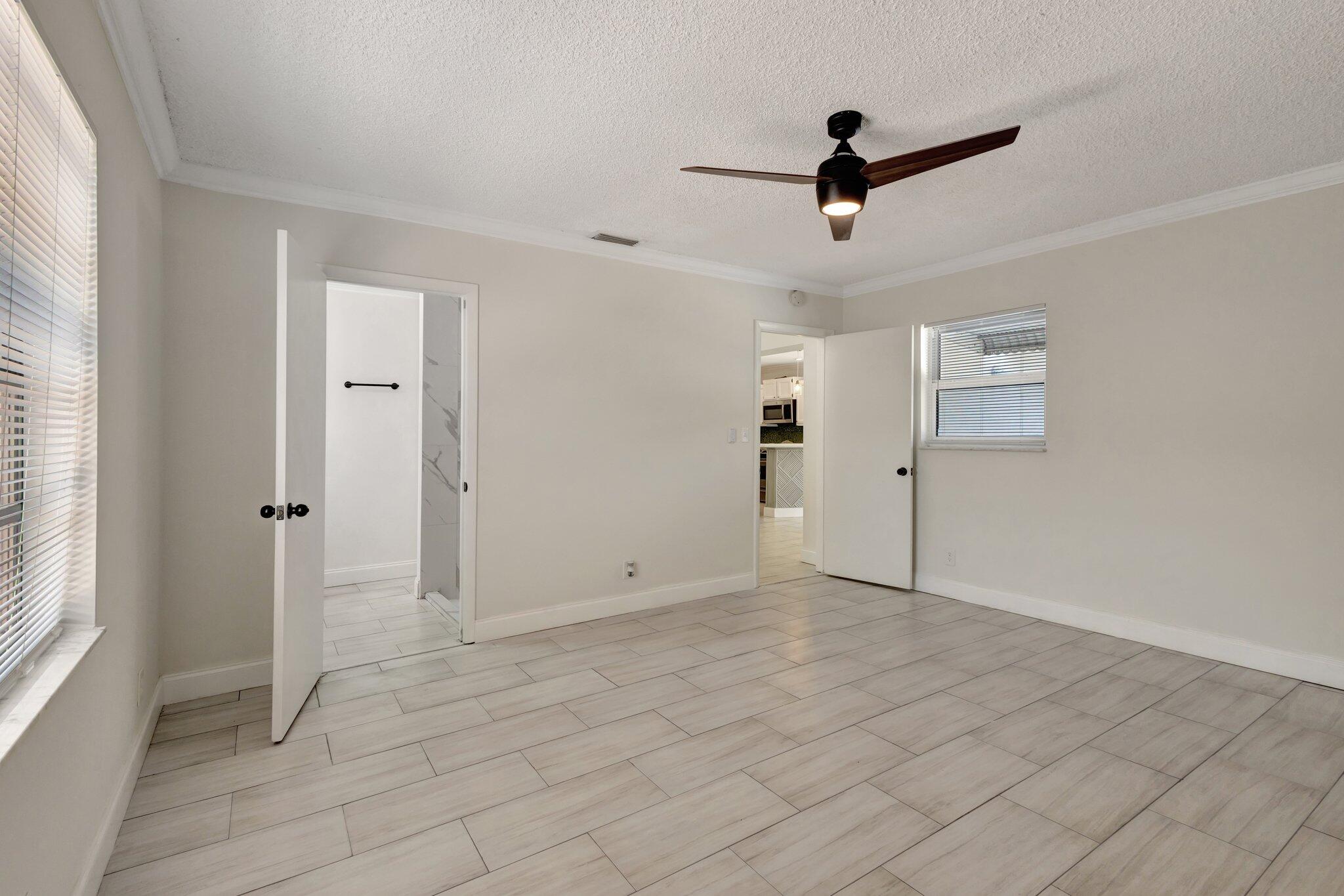 1225 16th Avenue North Lake Worth Beach, FL 33460 - Photo 6 of 18 a view of empty room with windows