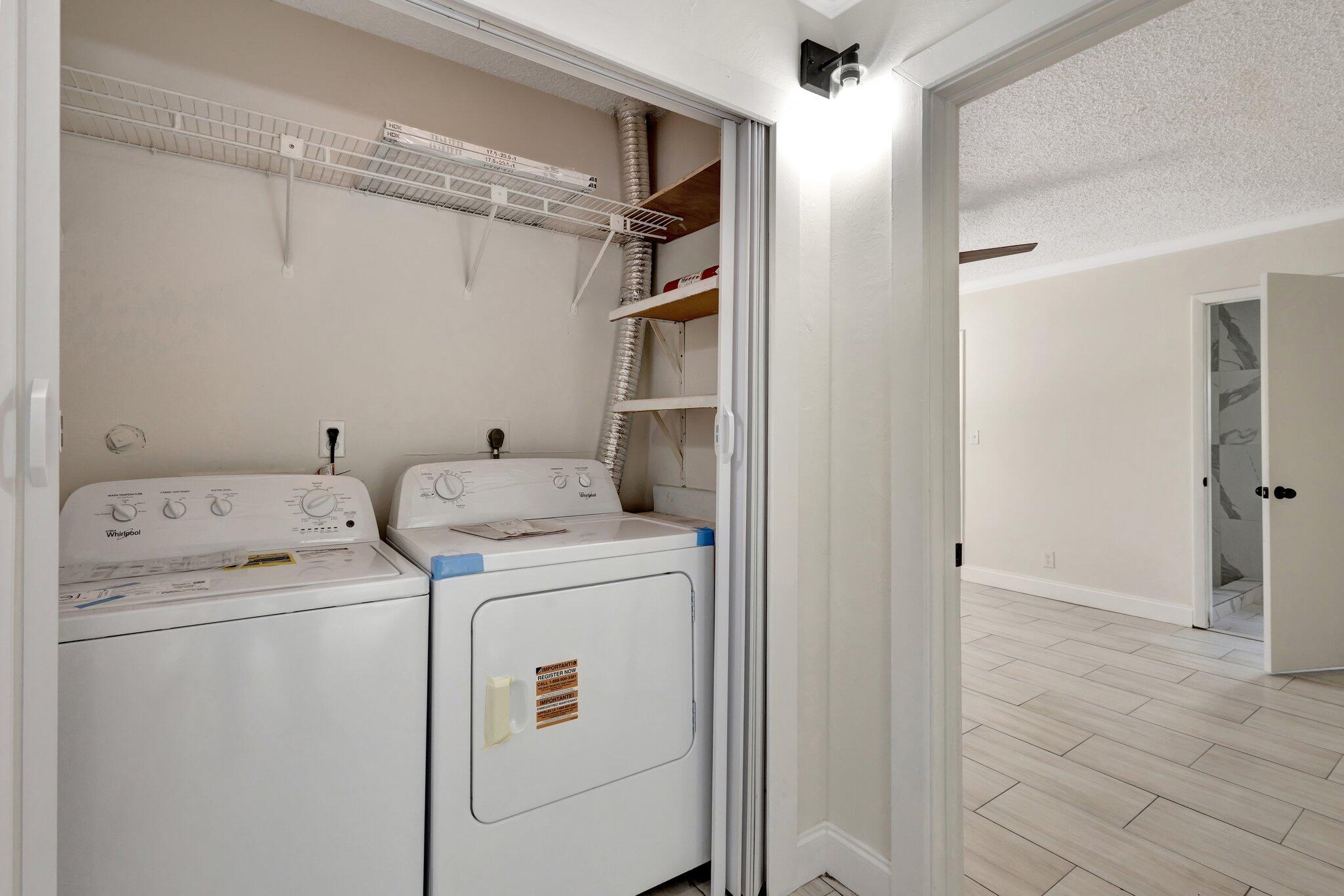 1225 16th Avenue North Lake Worth Beach, FL 33460 - Photo 9 of 18 a view of storage and utility room with washer and dryer