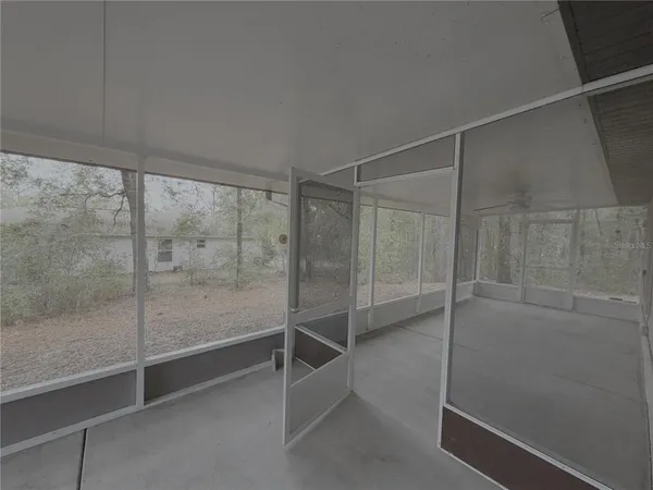a view of empty room with sliding door