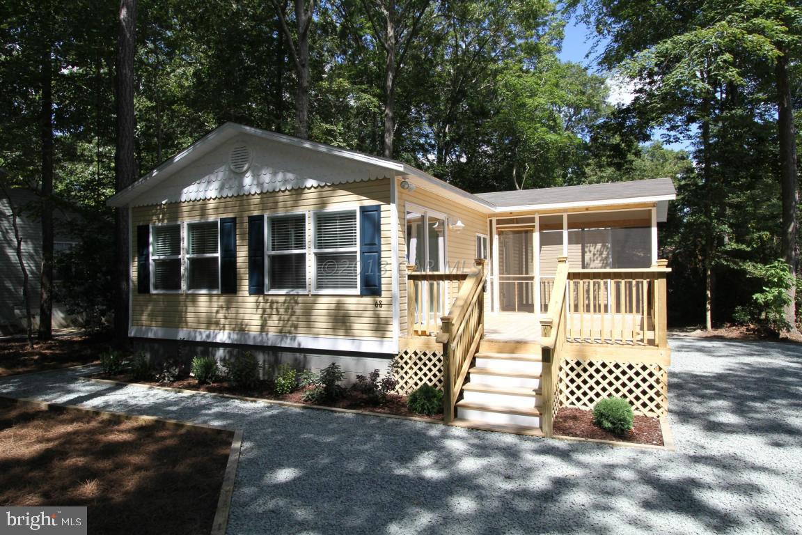 68 Sandyhook Road Ocean Pines, MD 21811 - Photo 1 of 35 a front view of a house with a yard
