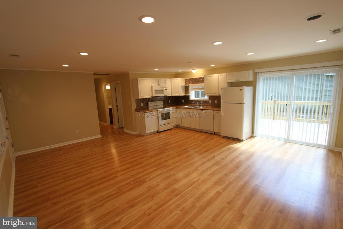68 Sandyhook Road Ocean Pines, MD 21811 - Photo 2 of 35 a view of a kitchen with a sink and a refrigerator