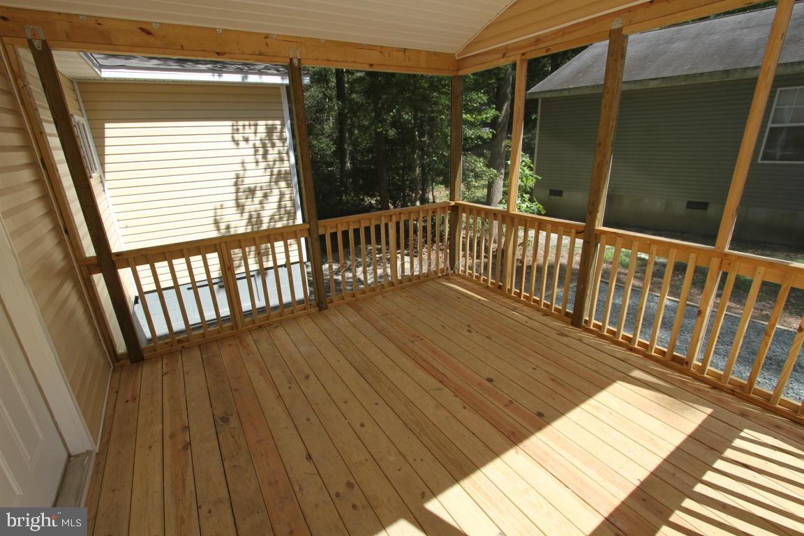 68 Sandyhook Road Ocean Pines, MD 21811 - Photo 23 of 35 a view of a balcony with wooden floor