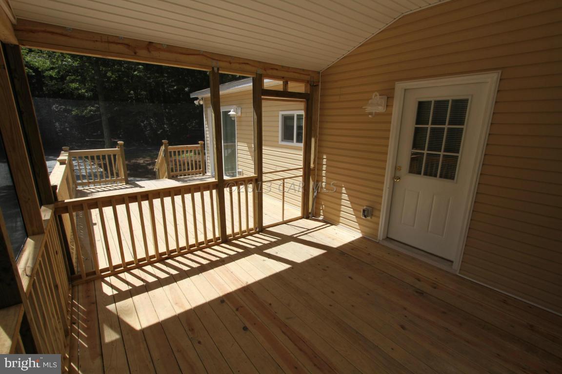 68 Sandyhook Road Ocean Pines, MD 21811 - Photo 25 of 35 a view of a balcony with wooden floor