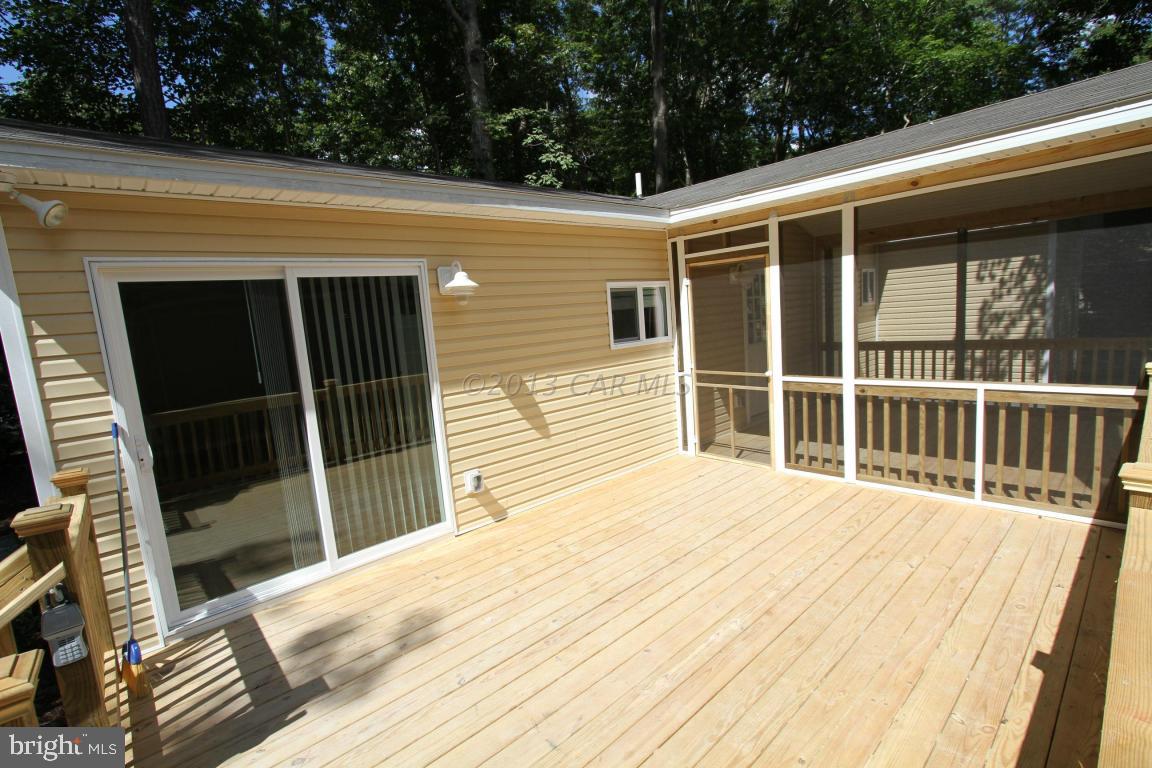68 Sandyhook Road Ocean Pines, MD 21811 - Photo 27 of 35 a view of a house with a large window