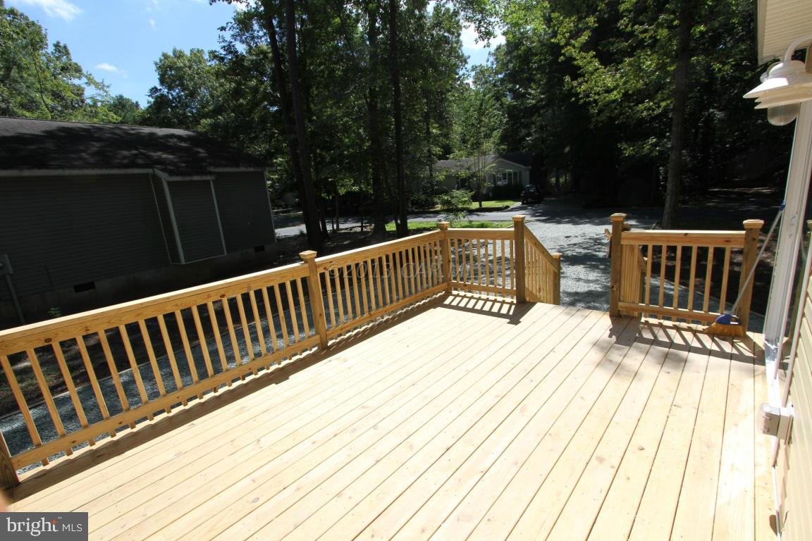 68 Sandyhook Road Ocean Pines, MD 21811 - Photo 29 of 35 a view of balcony with wooden floor and fence