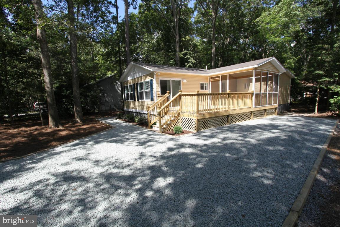68 Sandyhook Road Ocean Pines, MD 21811 - Photo 30 of 35 a view of a house with a yard