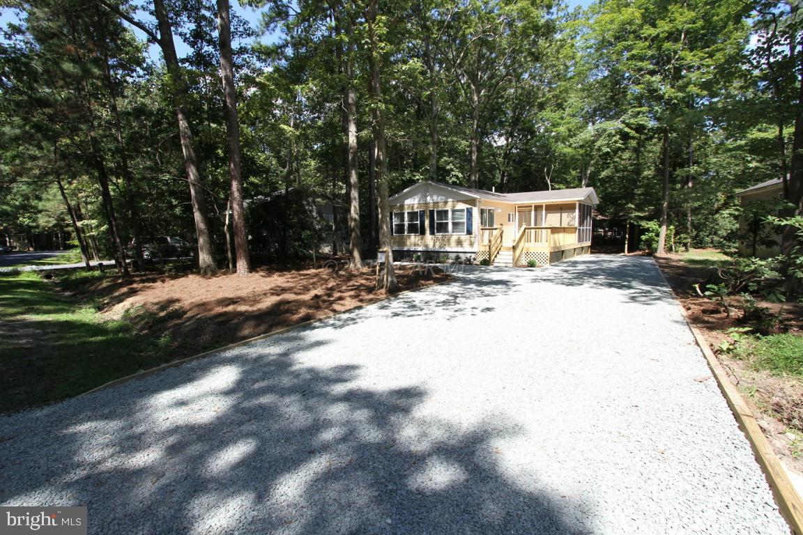 68 Sandyhook Road Ocean Pines, MD 21811 - Photo 32 of 35 a view of a house with a yard