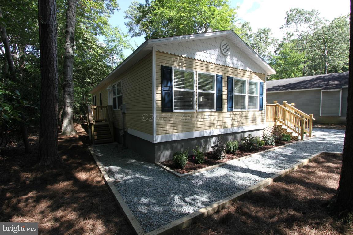 68 Sandyhook Road Ocean Pines, MD 21811 - Photo 34 of 35 a front view of a house with yard