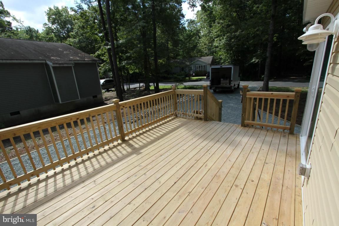 68 Sandyhook Road Ocean Pines, MD 21811 - Photo 8 of 35 a view of balcony with furniture and wooden deck