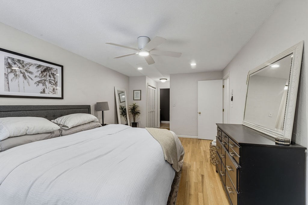 10 Erick Road, Unit 42 Mansfield, MA 02048 - Photo 21 of 33 a spacious bedroom with a bed and a chandelier