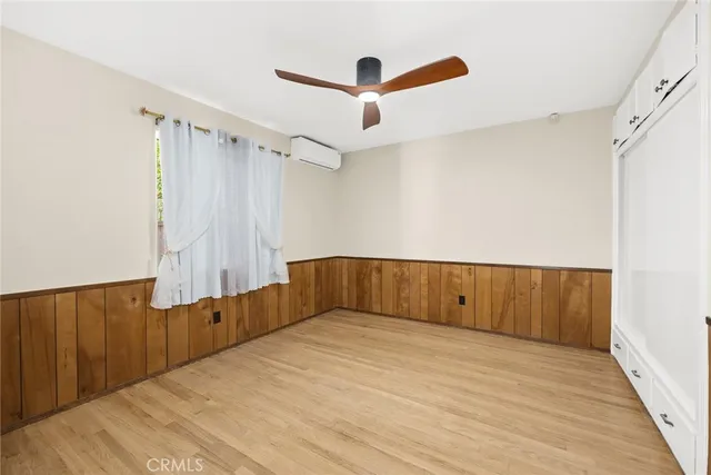 a view of room with wooden floor