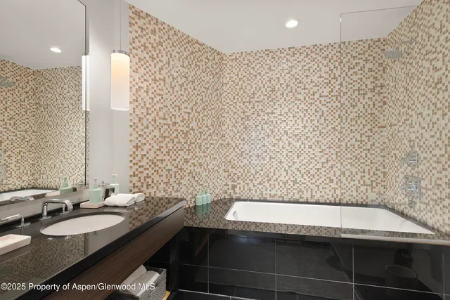 a bedroom with furniture and a large window