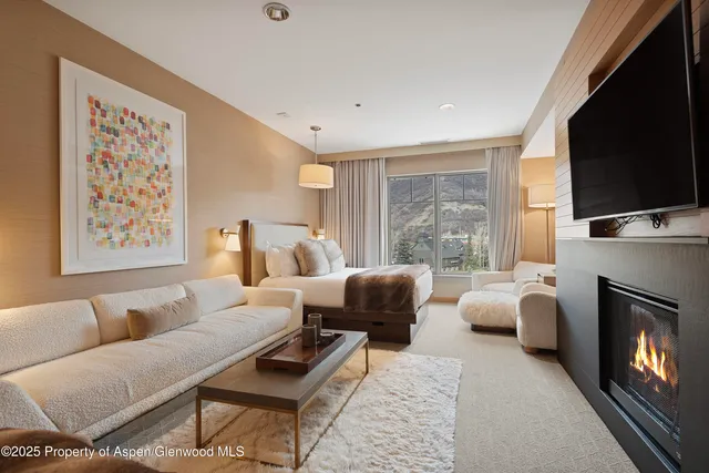 a bathroom with a sink mirror and a shower