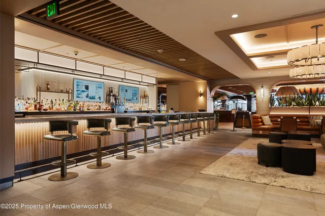 a room with gym equipment and large window