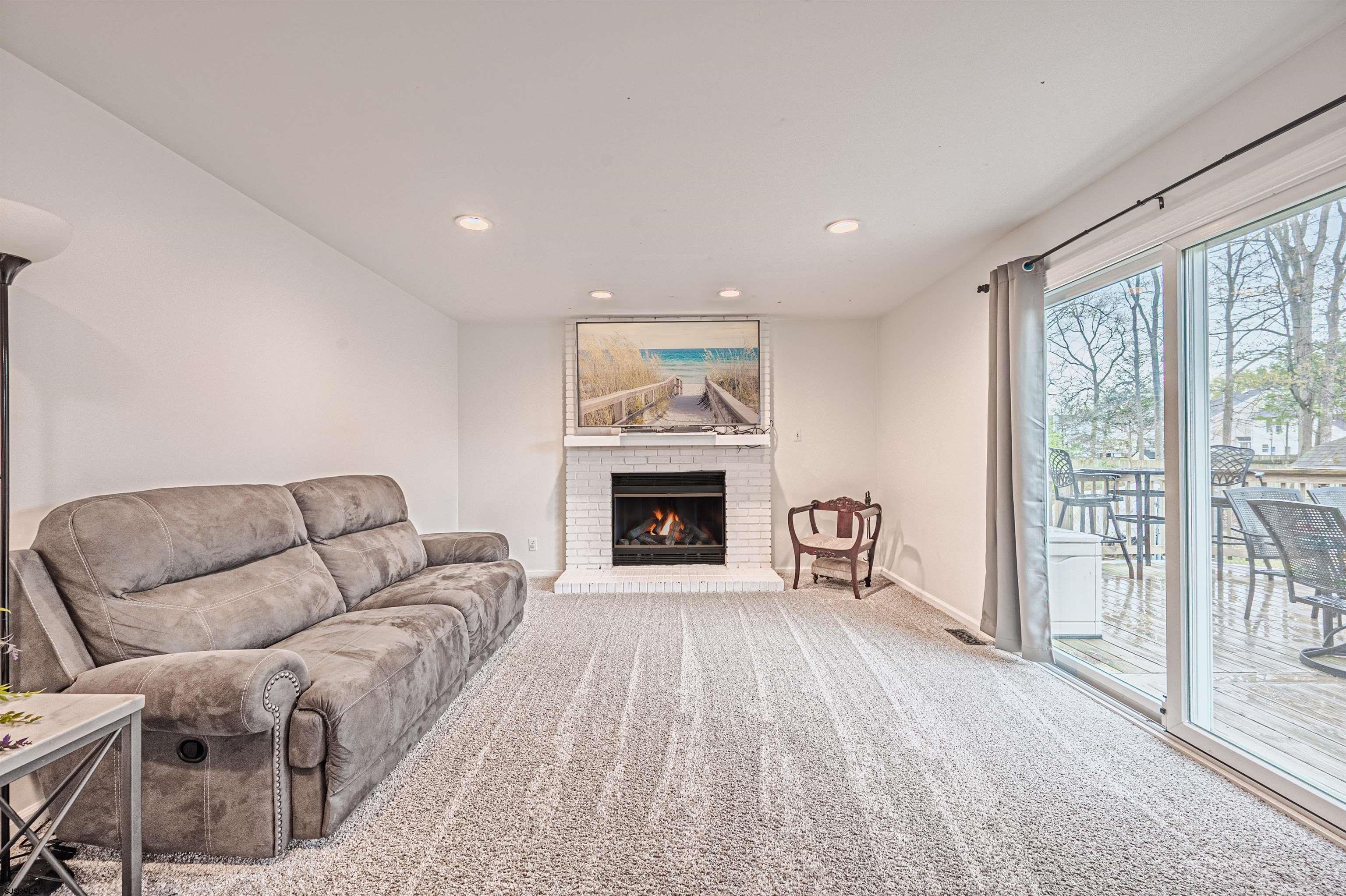 9 Rook Court Egg Harbor Township, NJ 08234 - Photo 12 of 27 a living room with furniture and a fireplace