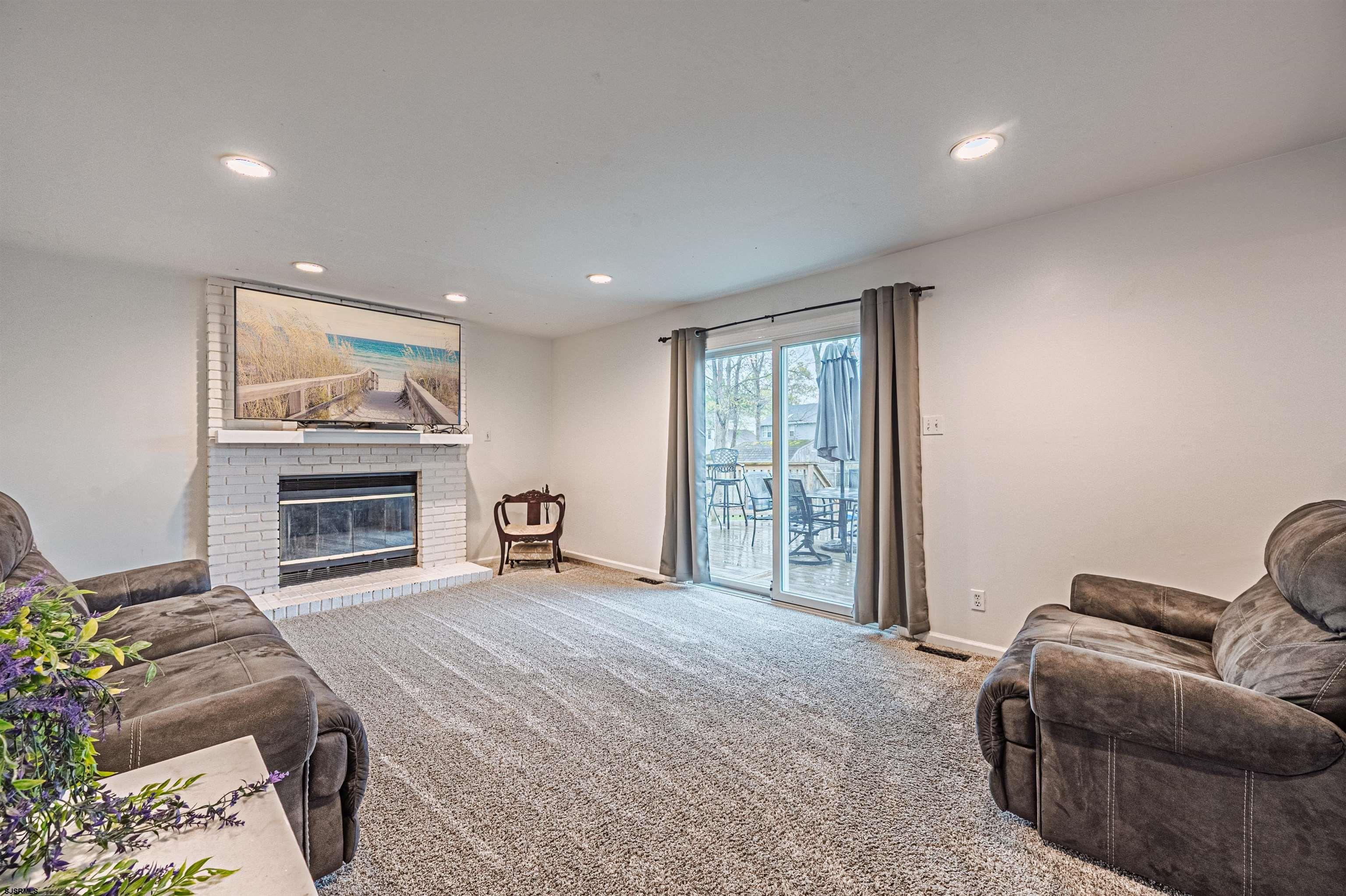 9 Rook Court Egg Harbor Township, NJ 08234 - Photo 13 of 27 a living room with furniture and a fireplace