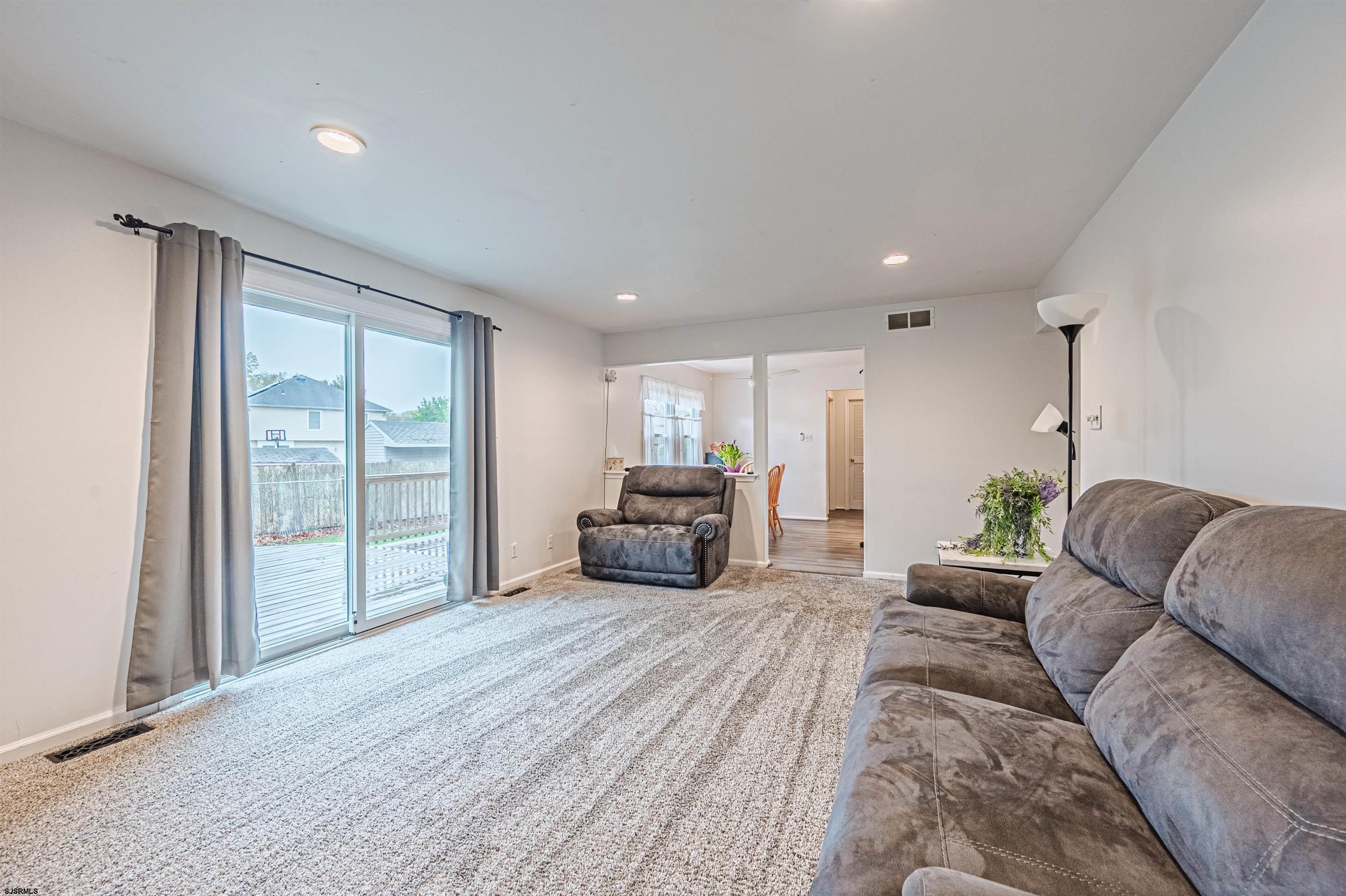 9 Rook Court Egg Harbor Township, NJ 08234 - Photo 14 of 27 a living room with furniture and a large window