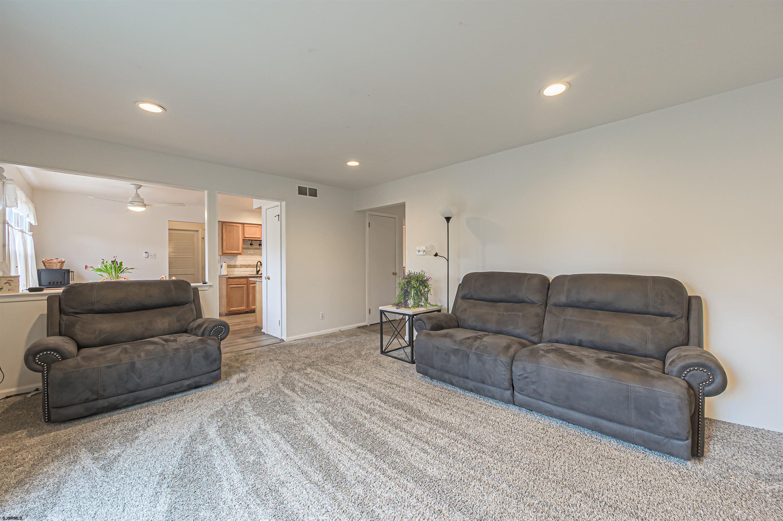 9 Rook Court Egg Harbor Township, NJ 08234 - Photo 16 of 27 a living room with furniture and a couch