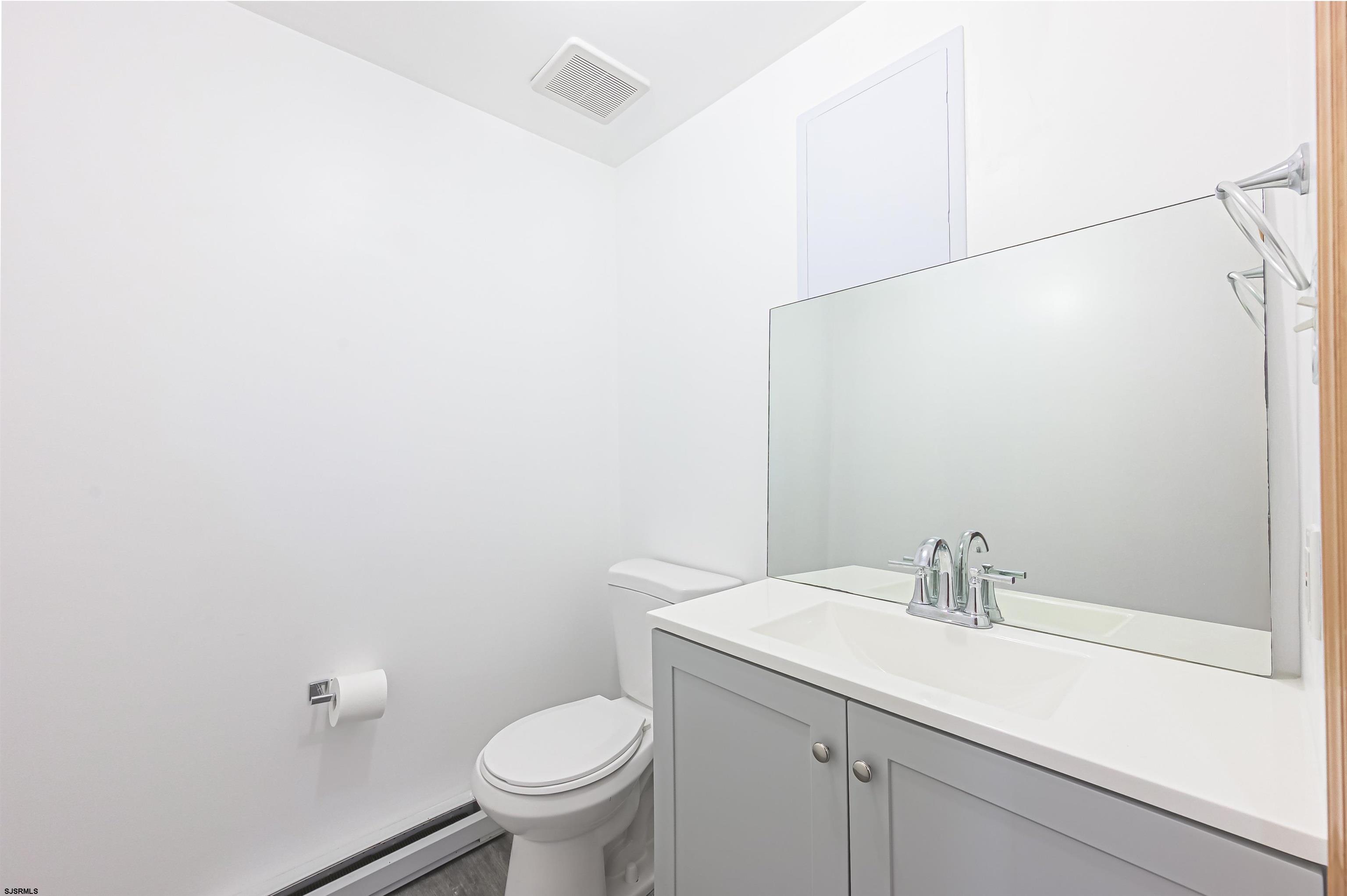 9 Rook Court Egg Harbor Township, NJ 08234 - Photo 19 of 27 a bathroom with a sink and toilet