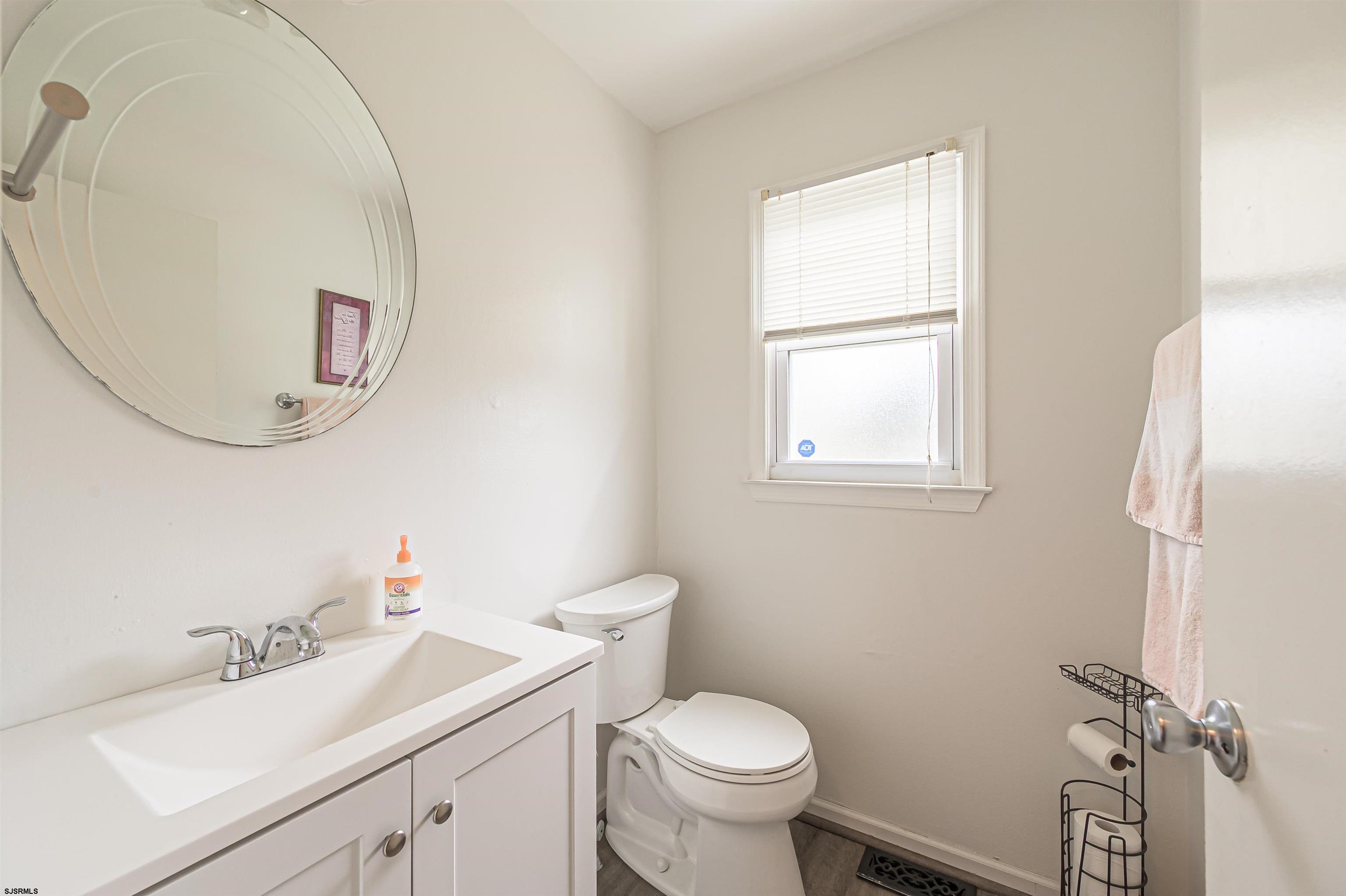 9 Rook Court Egg Harbor Township, NJ 08234 - Photo 20 of 27 a bathroom with a sink toilet and a mirror