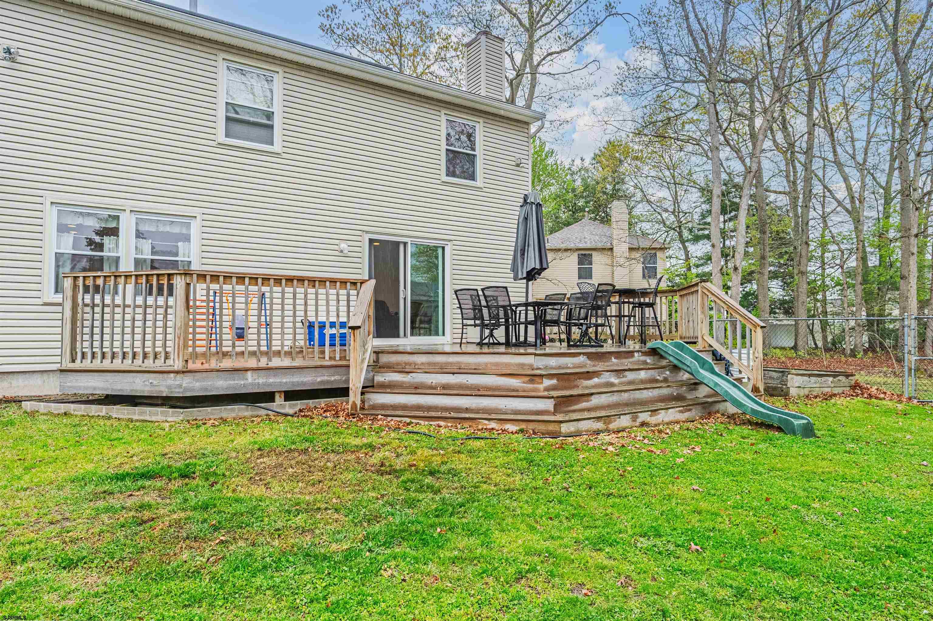 9 Rook Court Egg Harbor Township, NJ 08234 - Photo 23 of 27 a view of a house with a yard and a park