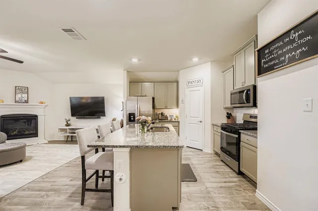 a bedroom with a bed and a desk