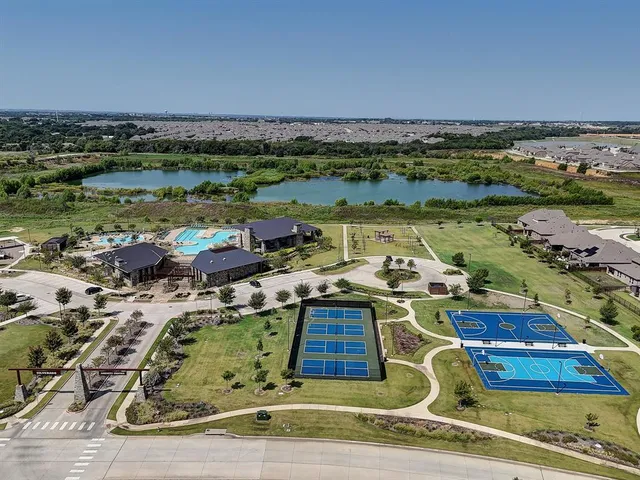 an aerial view of a house with a lake view