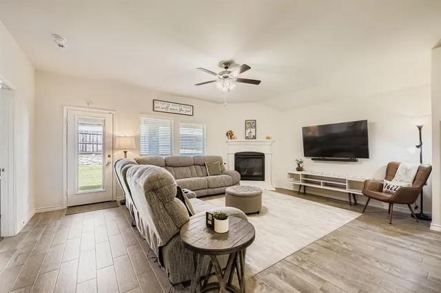 a living room with furniture and a fireplace