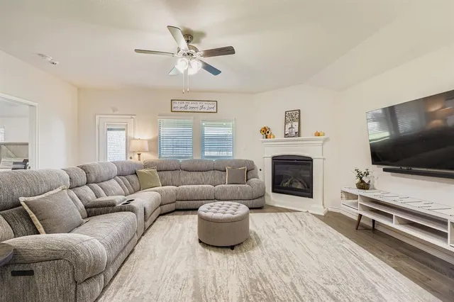 a living room kitchen with furniture and kitchen view