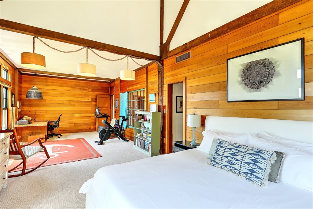 73 Brayton Point Road Westport, MA 02790 - Photo 27 of 40 a bedroom with a bed and wooden floor