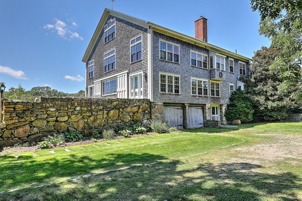 73 Brayton Point Road Westport, MA 02790 - Photo 5 of 40 a large building with a yard in front of it