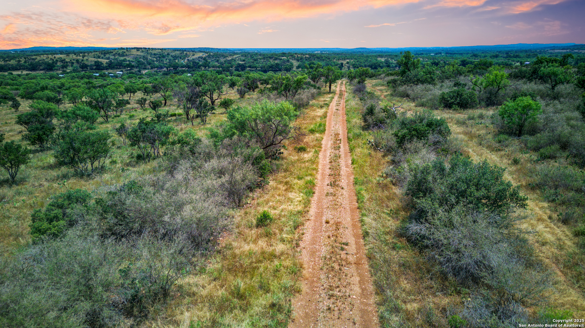 8661 Lower Willow Creek Road Mason, TX 76856 - Photo 5 of 5 a view of a city with lush green forest
